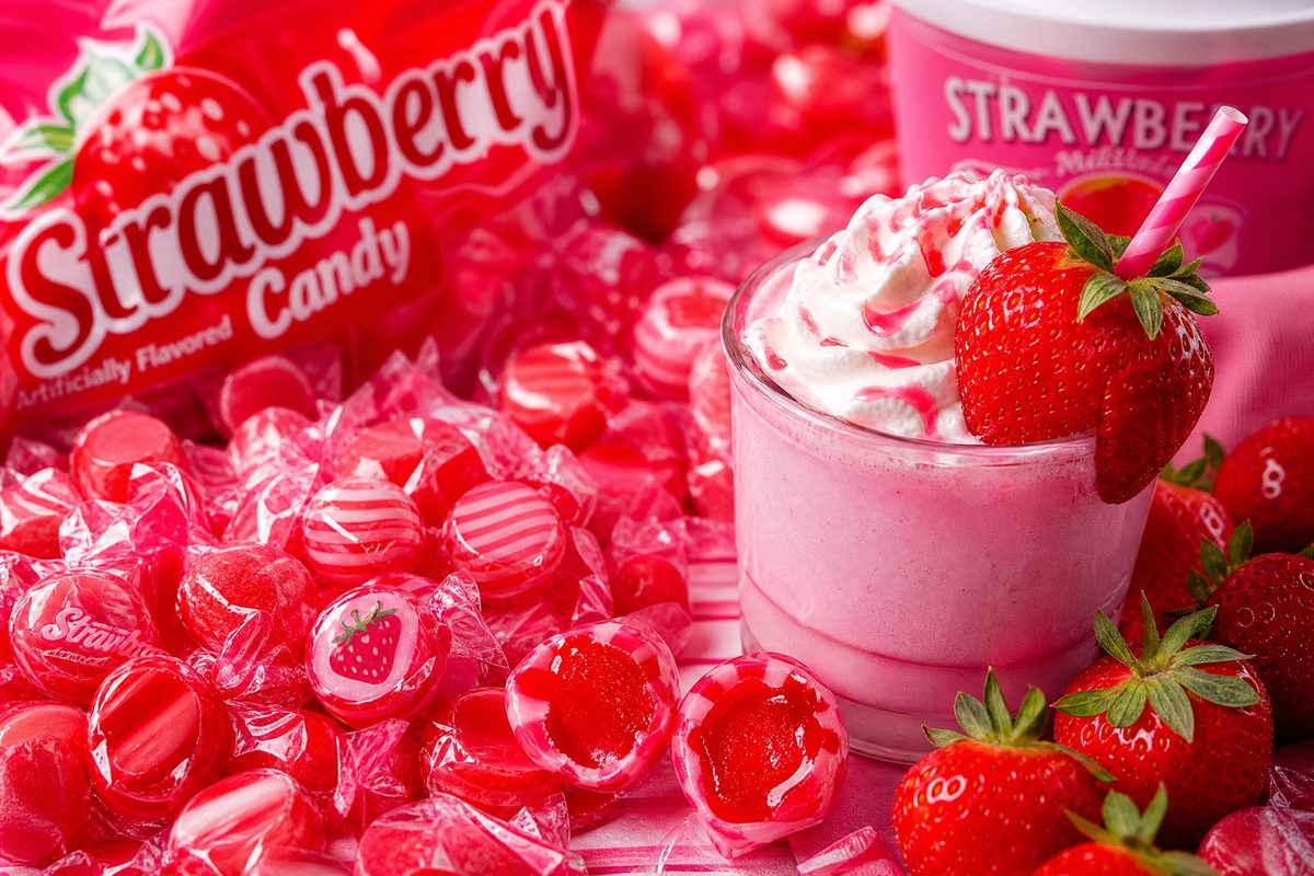 Fresh strawberries with a pink strawberry milkshake